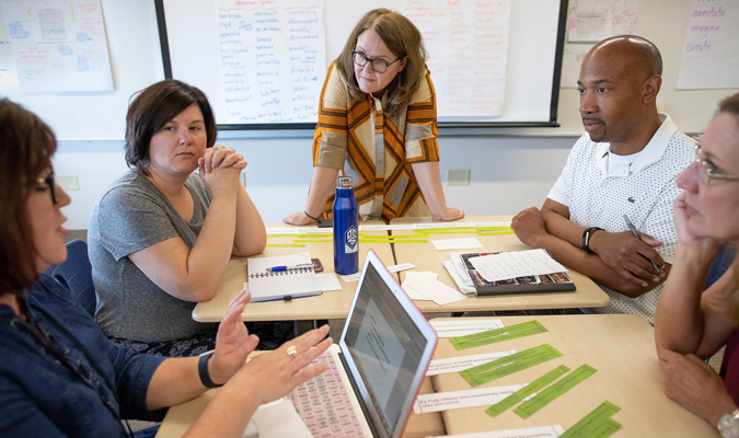 Leaders talking around a table